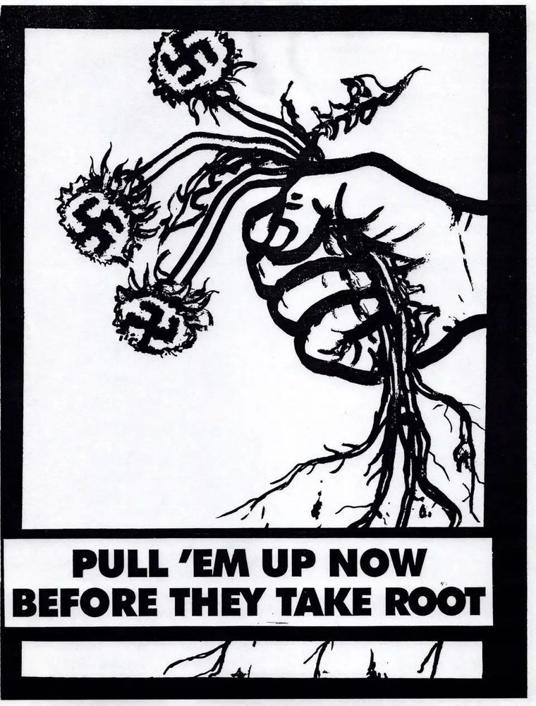 Image of an anti-fascist stamp/sticker/poster. It is a picture of a fist ripping up dandelions with swastikas in the centre of them. The text at the bottom says "Pull 'em up now before they take root"