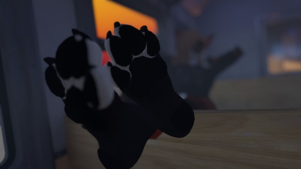 vrchat photo:
phox relaxing on a metro seat, both paws kicked up and crossed on the back of the seat in front of him, one set of toes splayed out