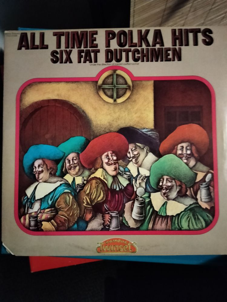 A photograph of the cover art for the album "All-Time Polka Hits" by Six Fat Dutchmen, featuring a whimsical and antique-style rendering presumably of the aforementioned six fat dutchmen