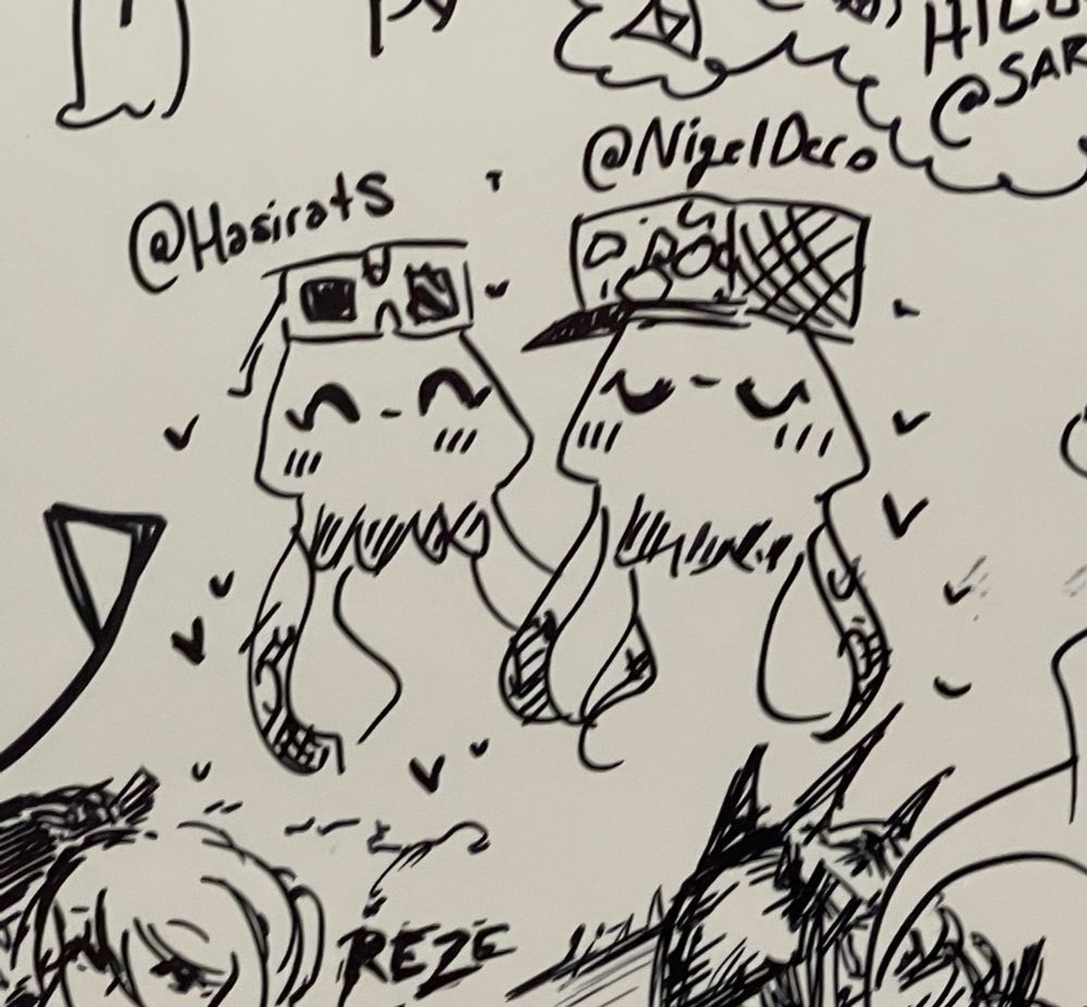 FestM/Anime Fiesta mural, super-duper zoomed in to focus on a drawing I made of my partner and I’s inklings in squid form together