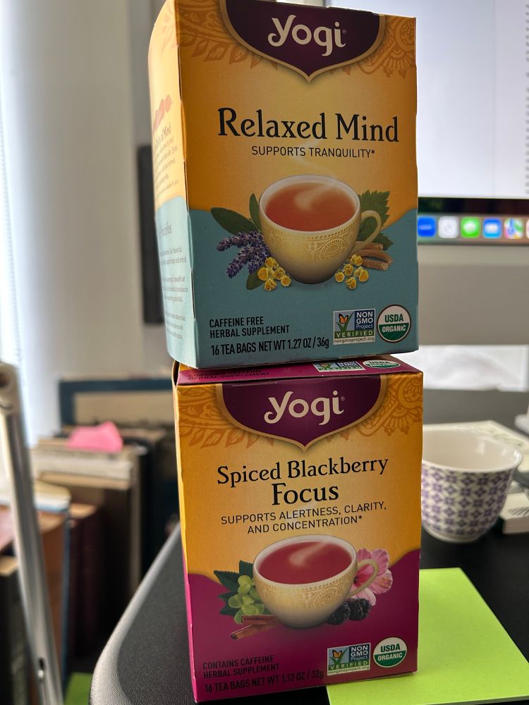 Two boxes of Yogi Tea, stacked: Spices Blackberry Focus on top and Relaxed Mind below.