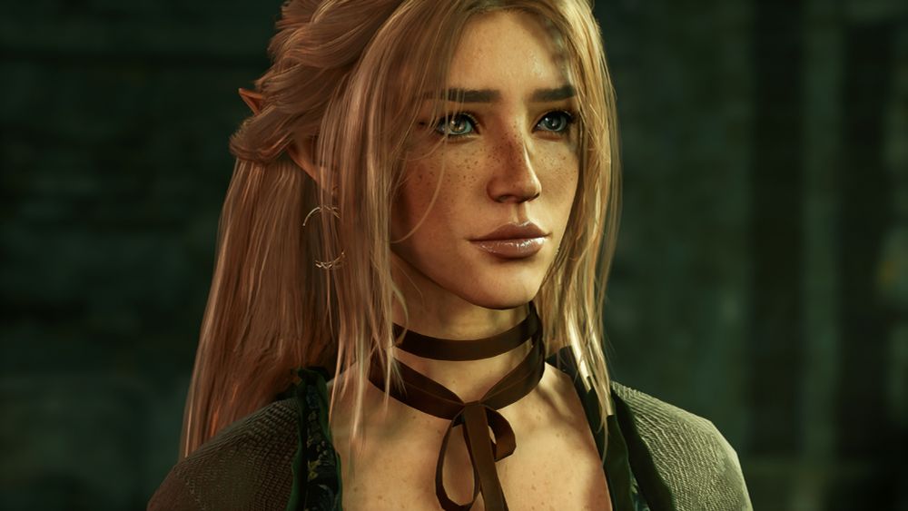 An image of a high elf woman, Enid, in Baldur's Gate 3. The cutscene is from when Tav meets Withers. Enid's eyes are a hazel and chocolate brown, and her hair is a light strawberry blonde.