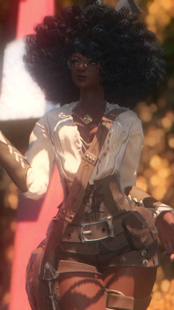 Vida (Rava Viera) poses with one hand resting to her left side and the other slightly raised to the side on her right side. She looks away towards the camera with a soft smile.