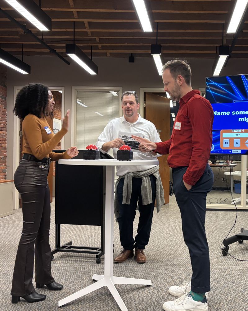 Team members playing a game of Family Feud