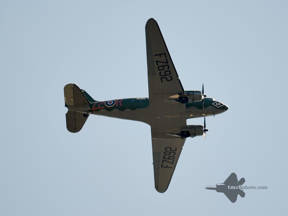 A glimpse of the C-47 Dakota as it passed over Toronto on its way back from CFB Trenton for an 80th anniversary of VE Day event. The sky is clear, and the markings of the plane feature the letters FZ692.