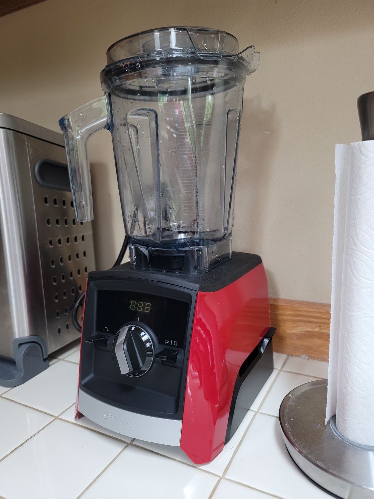 Photo of a Vitamix blender with a red and black base. 