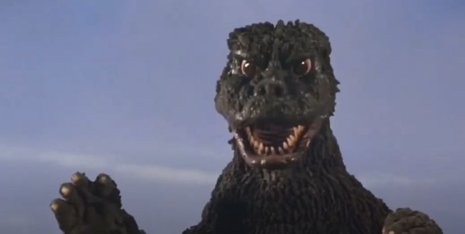 Godzilla roaring at the camera, eyes shining with hope