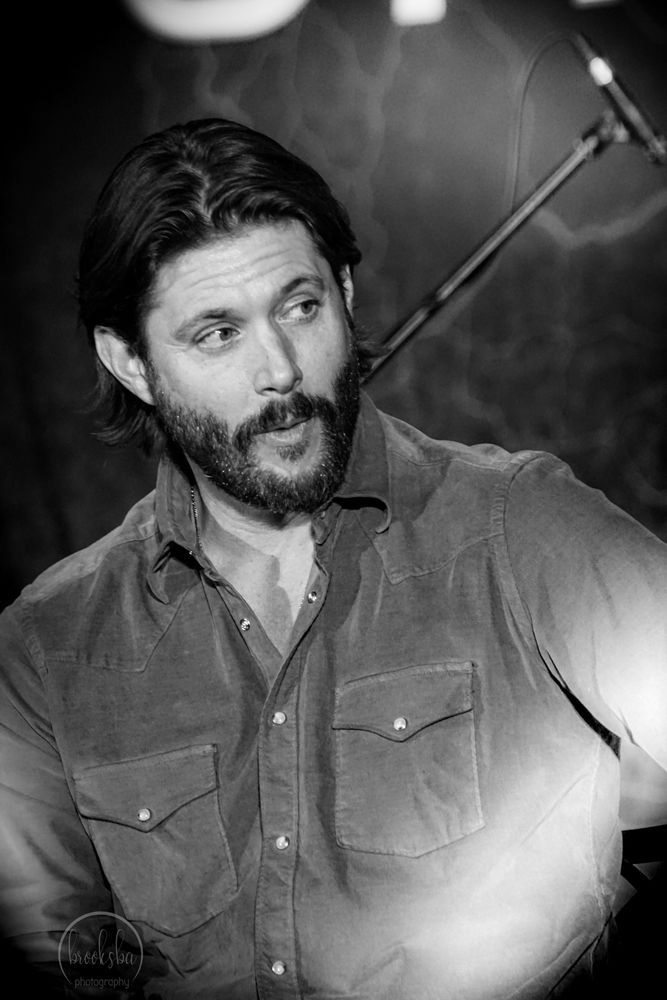 Black and white image of Jensen Ackles at recent Minnesota Convention. Man is ridiculously well put together. 
