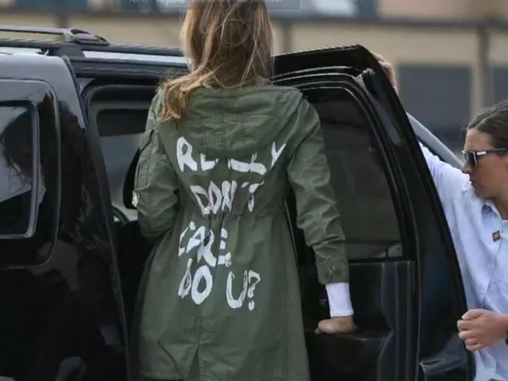 Now infamous photo of Melania Trump, wearing the army green jacket that reads “I REALLY DON’T CARE DO U?” on the back.