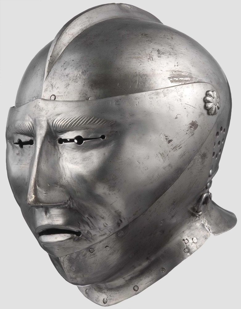 a medieval full-visor helmet in the style of an oaf's face