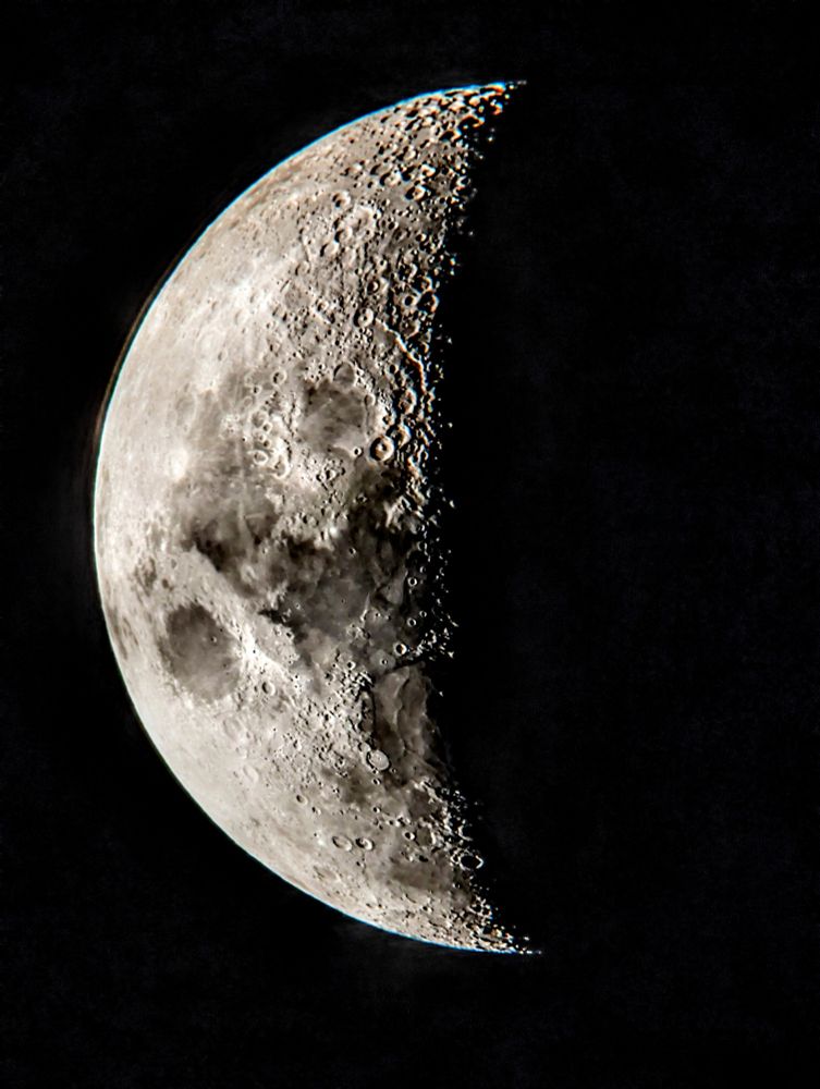 The moon, half in shadow