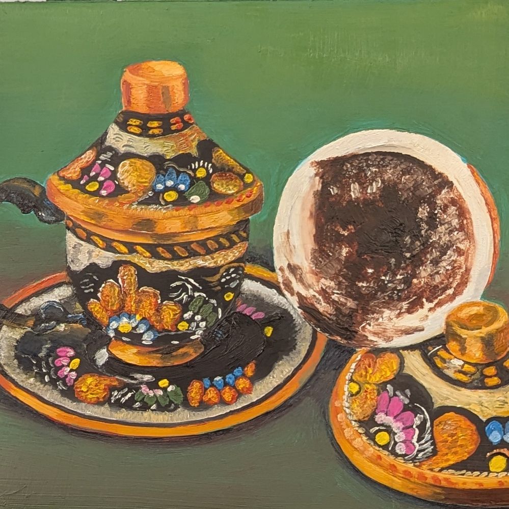 Two copper Turkish coffee cups, one on its side
