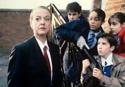 A promotional shot of the 1992 kids show Wail of the Banshee. It shows a woman in a suit, one of the Banshees, being fearfully stared at by the shows young protagonists.