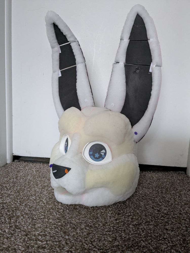WIP of a foam fursuit bunny head with blue eyes