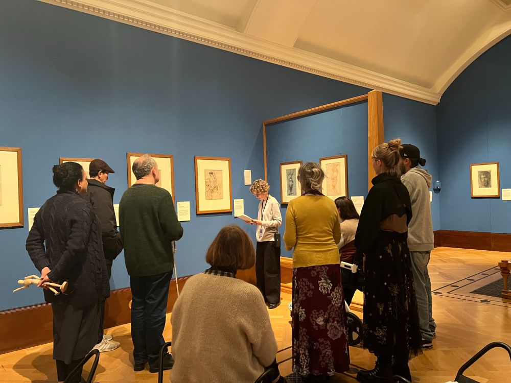 SLC volunteers gathered around Catherine, our host, who is describing the drawing ‘Hercules and Antaeus’ at the Kings Gallery. This drawing was in the ‘blue room’