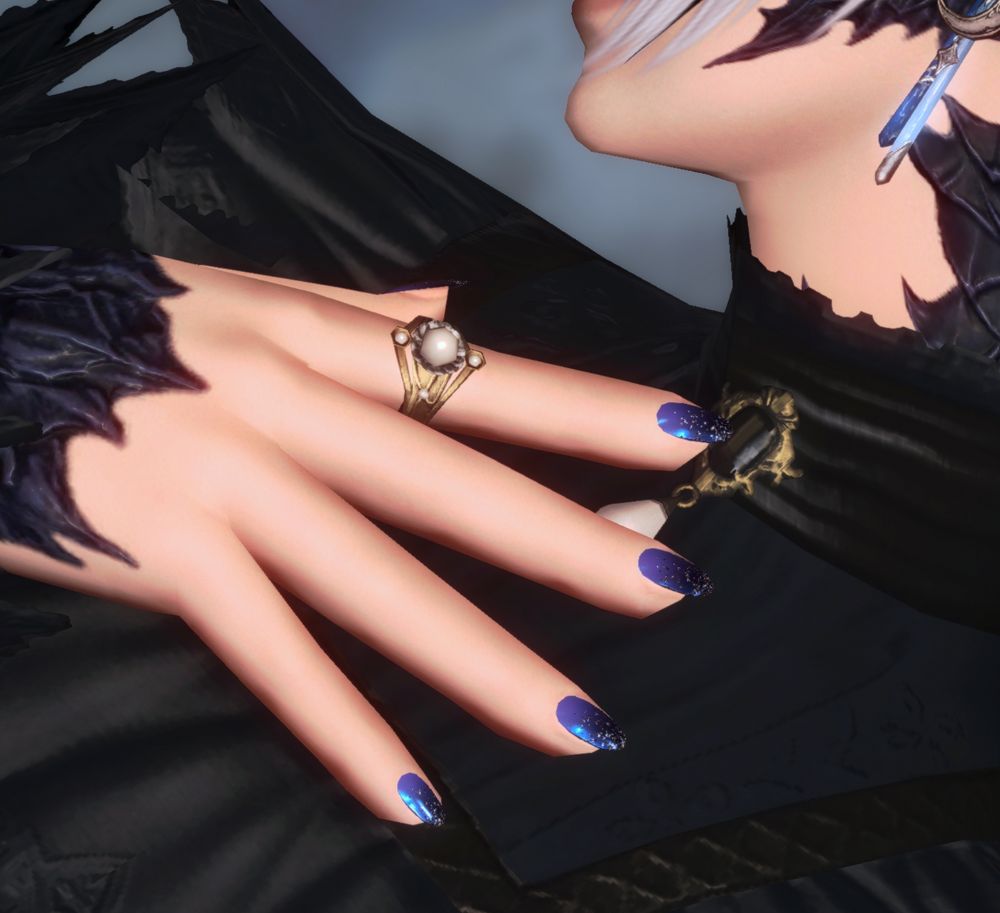 zoomed in screenshot of au ra player character from ffxiv on hands to showcase nail decor