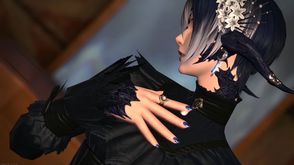 close up screenshot of au ra player character posing with hand to chest, looking off to the side, wearing metallic blue nails with blue attire