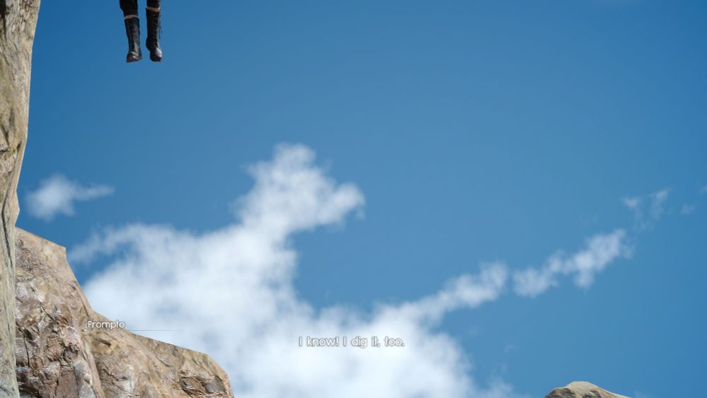 screenshot from ffxv of a blue sky with some clouds, and human legs (noctis) cut off at the top left of the screen as though floating in the sky