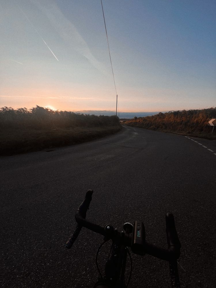 My bike, at sunrise today on a rural lane. 