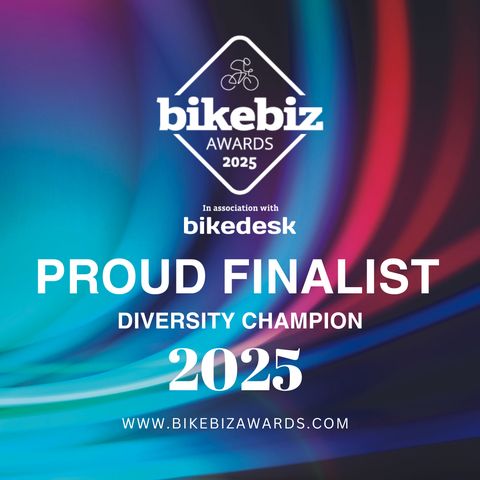 Stylised red and blue aurora borealis background with white text overlaid it which says "Bikebiz Awards 2025 Proud Finalist, Diversity Champion 2025"