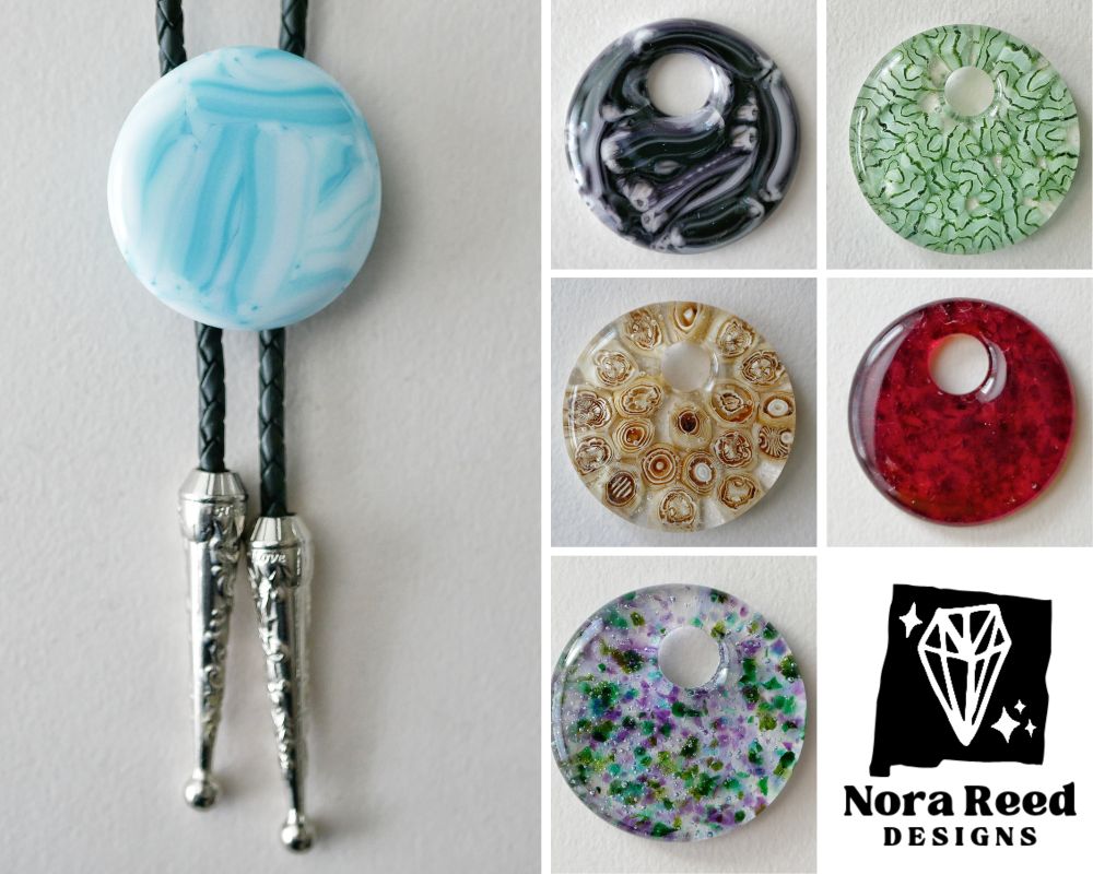 a blue and white round brushstroke bolo tie and 5 round pendants: a purple one with a brushstroke pattern, a green one with leaves, am abstract amber/brown one, a mottled red and a mottled purple and green 