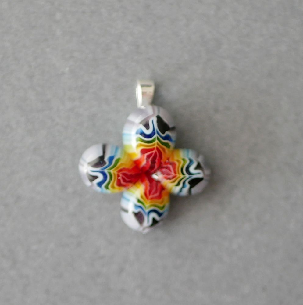 rainbow pride flower pendant with petals that have red in the middle 