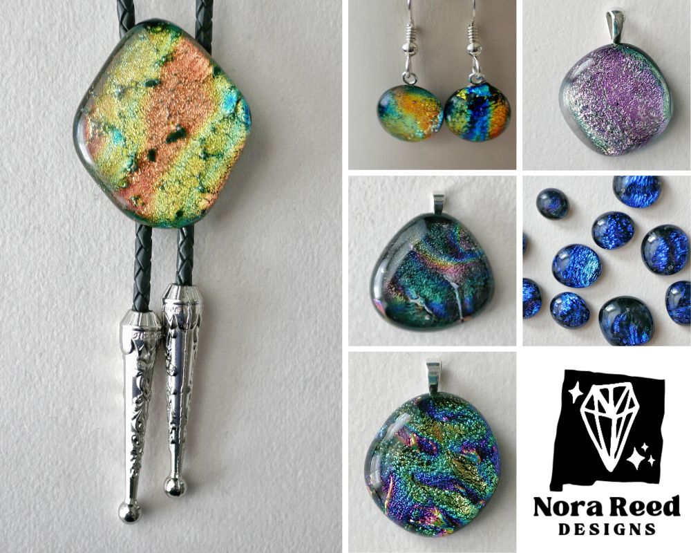 various dichroic jewelry items including a green and orange bolo tie, some rainbowy earrings, a pink pendant, a couple of teal and purple pendants, and some blue game tokens