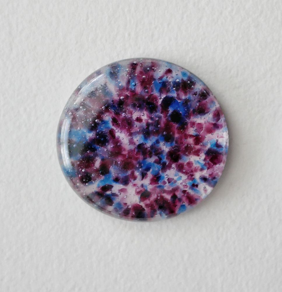 circular worry stone in the bi pride colors 
