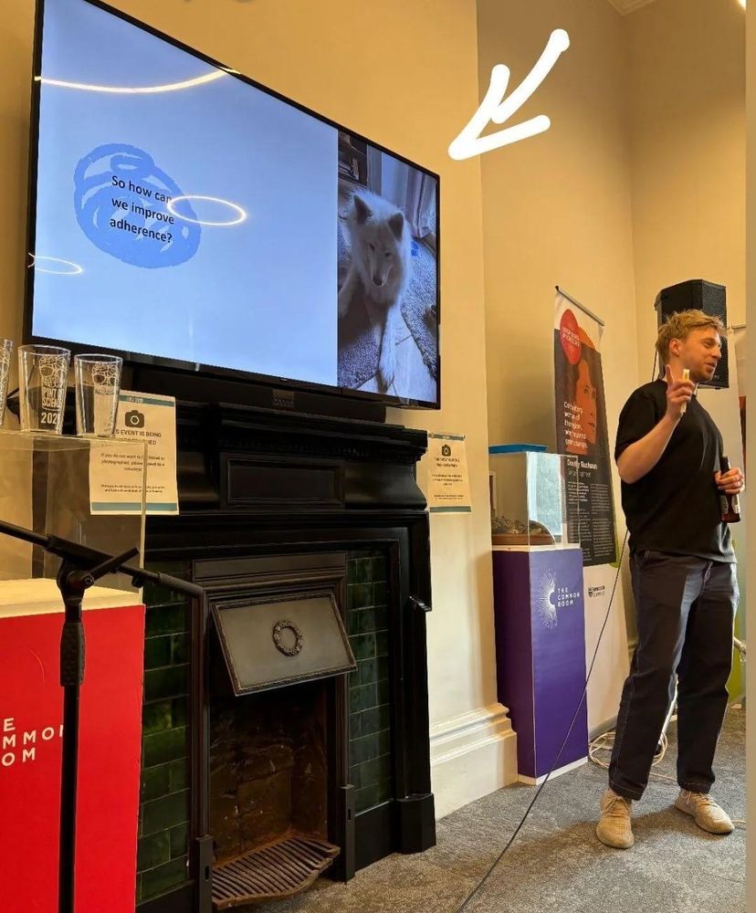 A researcher giving a pint of science talk on medication adherence 