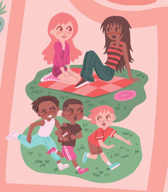 A young redheaded woman in pink sits smiling across from an emo black woman on a checkered picnic blanket, on a patch of grass. Three boys play football on a nearby patch of grass, implicitly the ladies' siblings. 