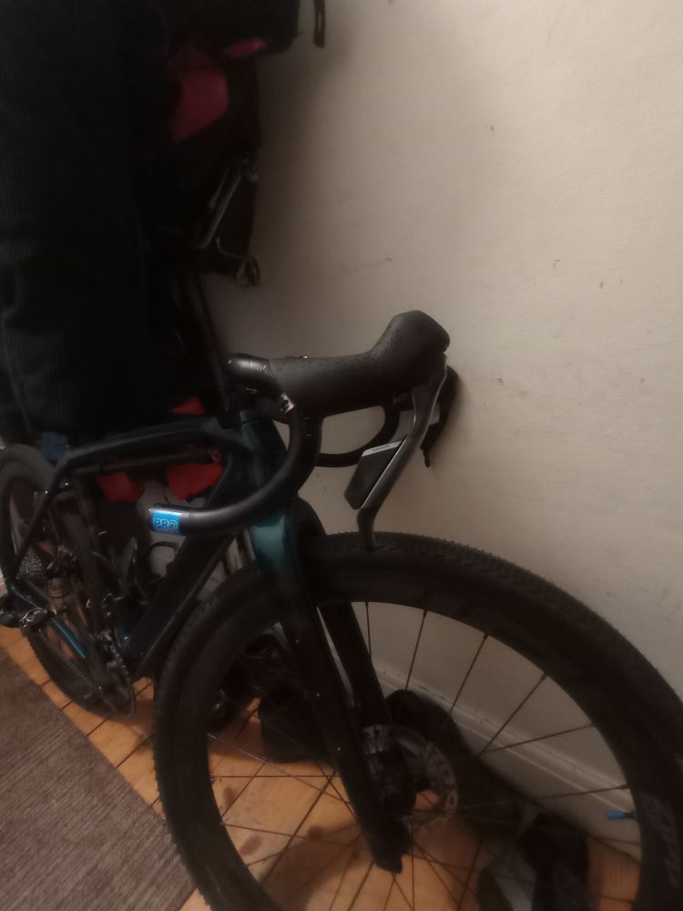 The new SRAM Rival brake levers on my gravel bike in my hallway 