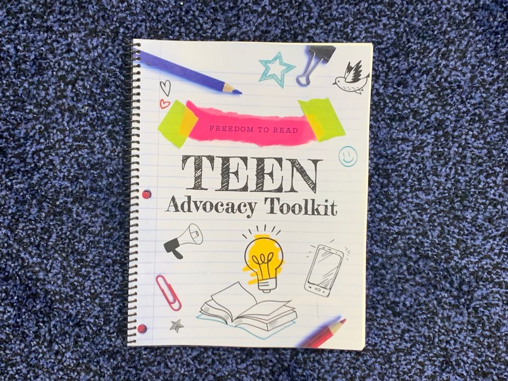 Image of a spiral bound book. It says “Freedom to read teen advocacy toolkit.”