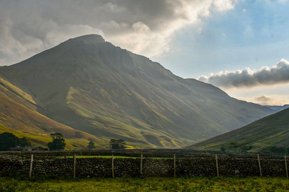 The glorious Great Gable, illuminated by morning lights from the farmland of Wasdale Head, Lake District, Uk.