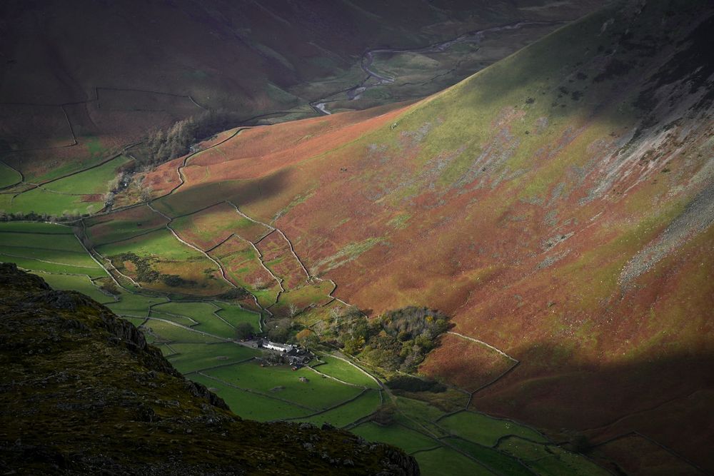 Burnthwaite farm looking tiny but shining brightly from the top of Lingmell in the LakeDistrict. 