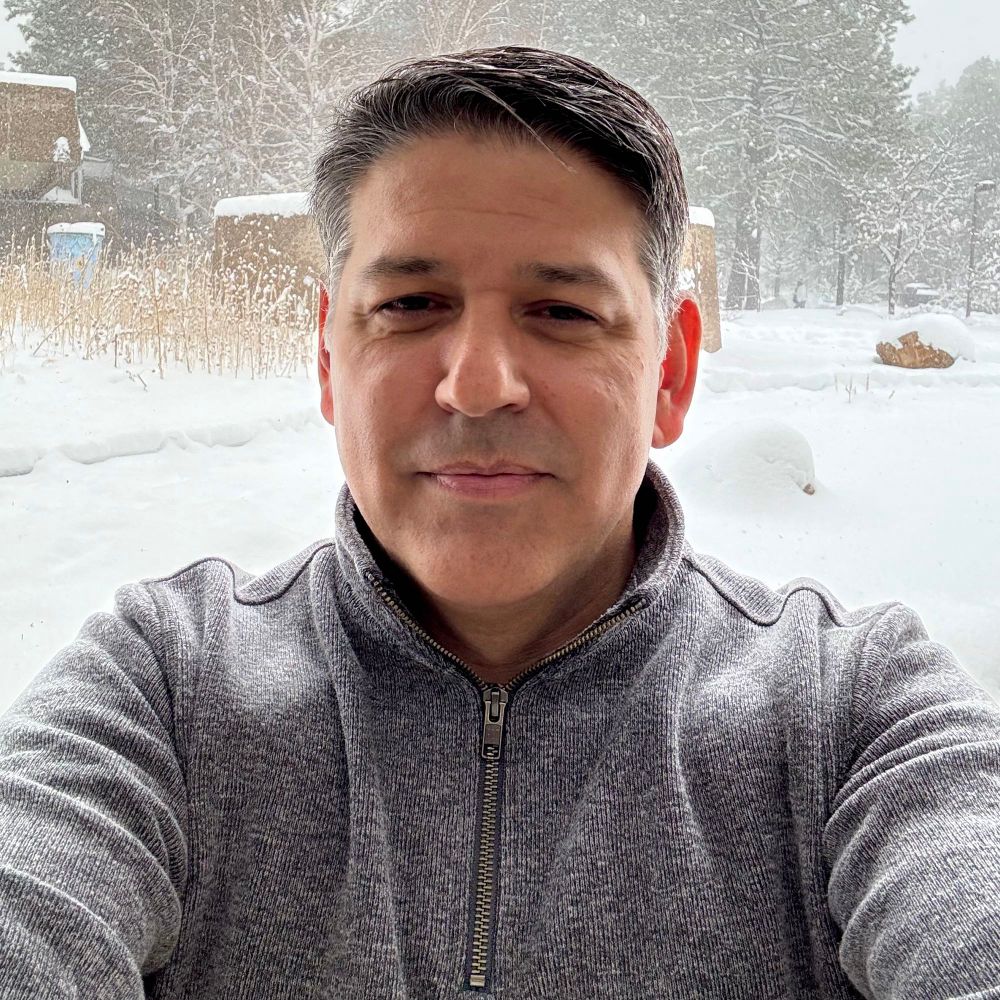 A selfie of me with snow in the background 