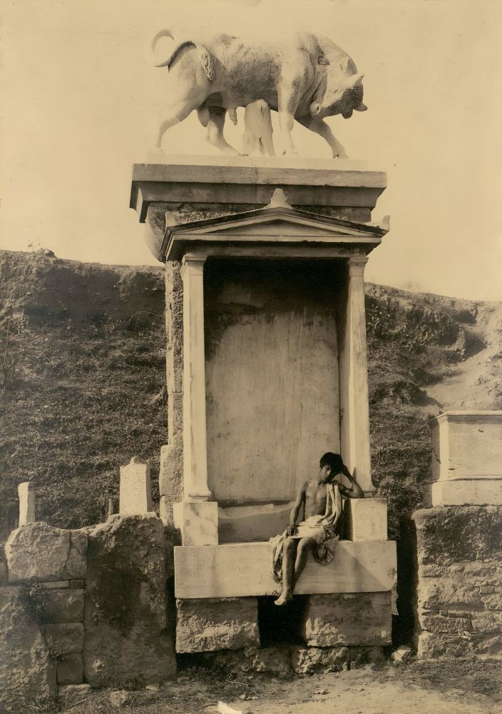 Wilhelm von Plüschow (1852-1930), Boy sitting in front of the tomb for Dionysios of Kollitos (late 4th century BC) in the Street of Tombs in the Ancient Greek Kerameikos Cemetery (Athens) (1895).