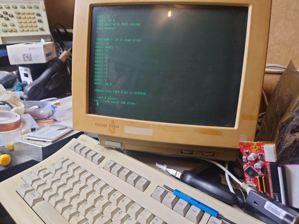 A close up of the VT-420 from the last image, showing towards the bottom of the screen 

"23Boot from ra(0, 0, 0) at 0172150"
:
: ra(0, 0, 0)unix
Can't load split I&D files
: "