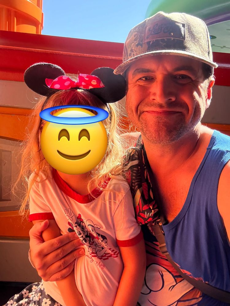 Balatro and Bruce waiting for a spinny ride