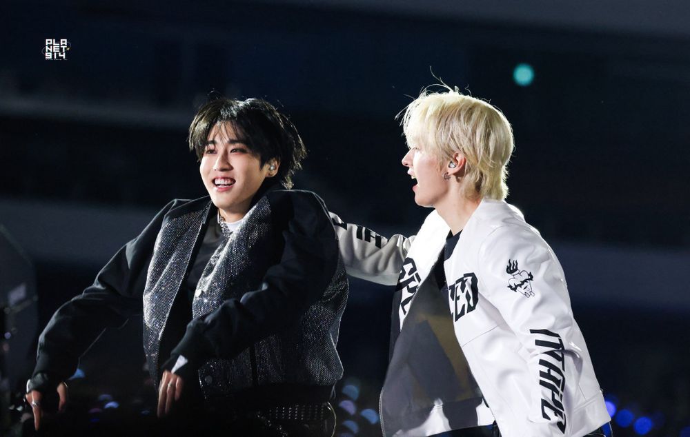 Stray Kids Lee Know grabbing Han by the back of the neck at dominATE encore, October 2025