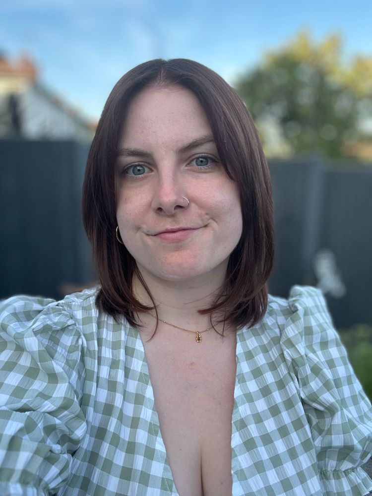it’s me! with brown hair, wearing a green gingham puffed sleeve dress