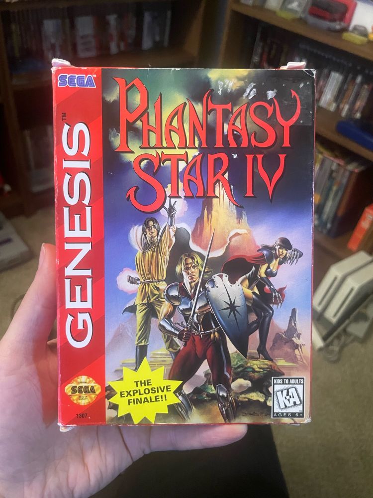 CIB copy of Phantasy Star IV for the Sega Genesis. Cover art shows a group of fantasy warriors making a pose, with the text “Phantasy Star IV” on the upper portion of the artwork.