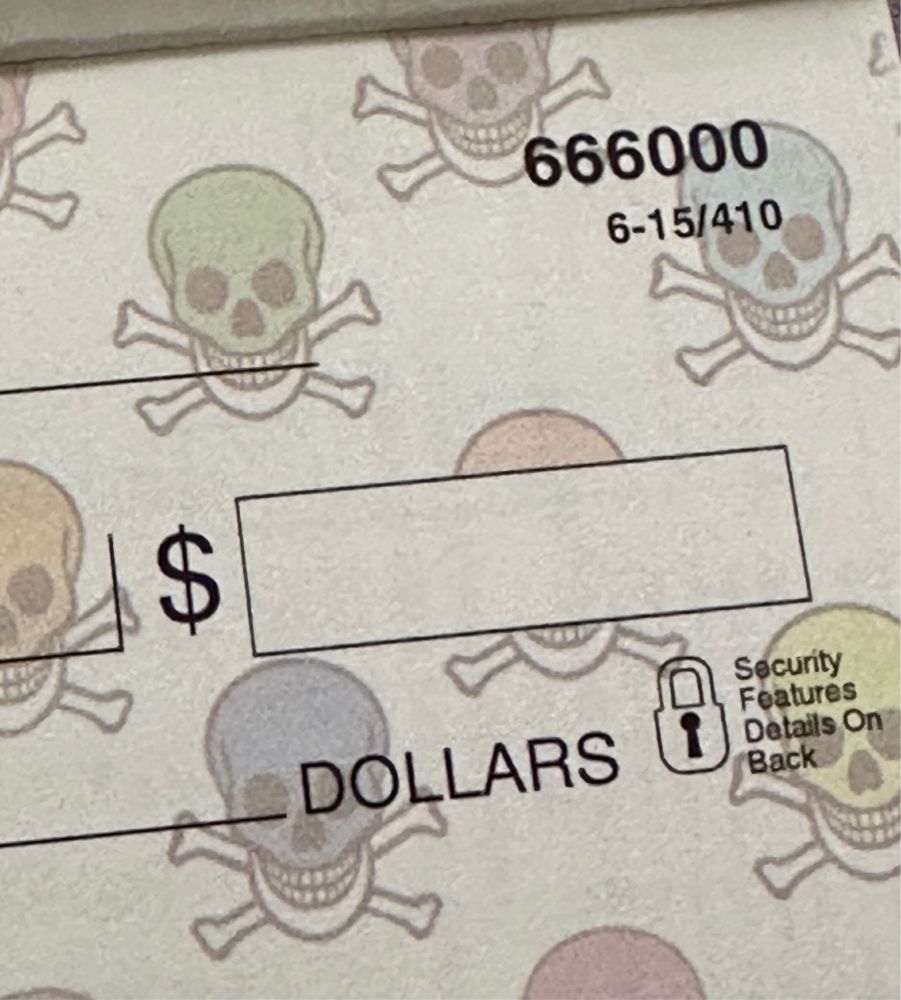 a check showing number 666000, with rainbow skull and crossbones in the background