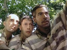 Three clearly dangerous escaped convicts in striped clothing.