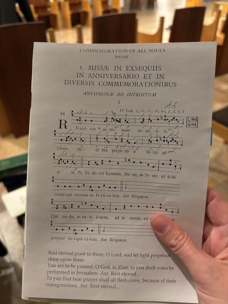 The Latin plainsong introit for a requiem with the English translation.