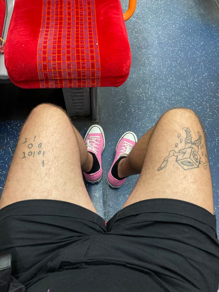 Black shorts and pink shoes