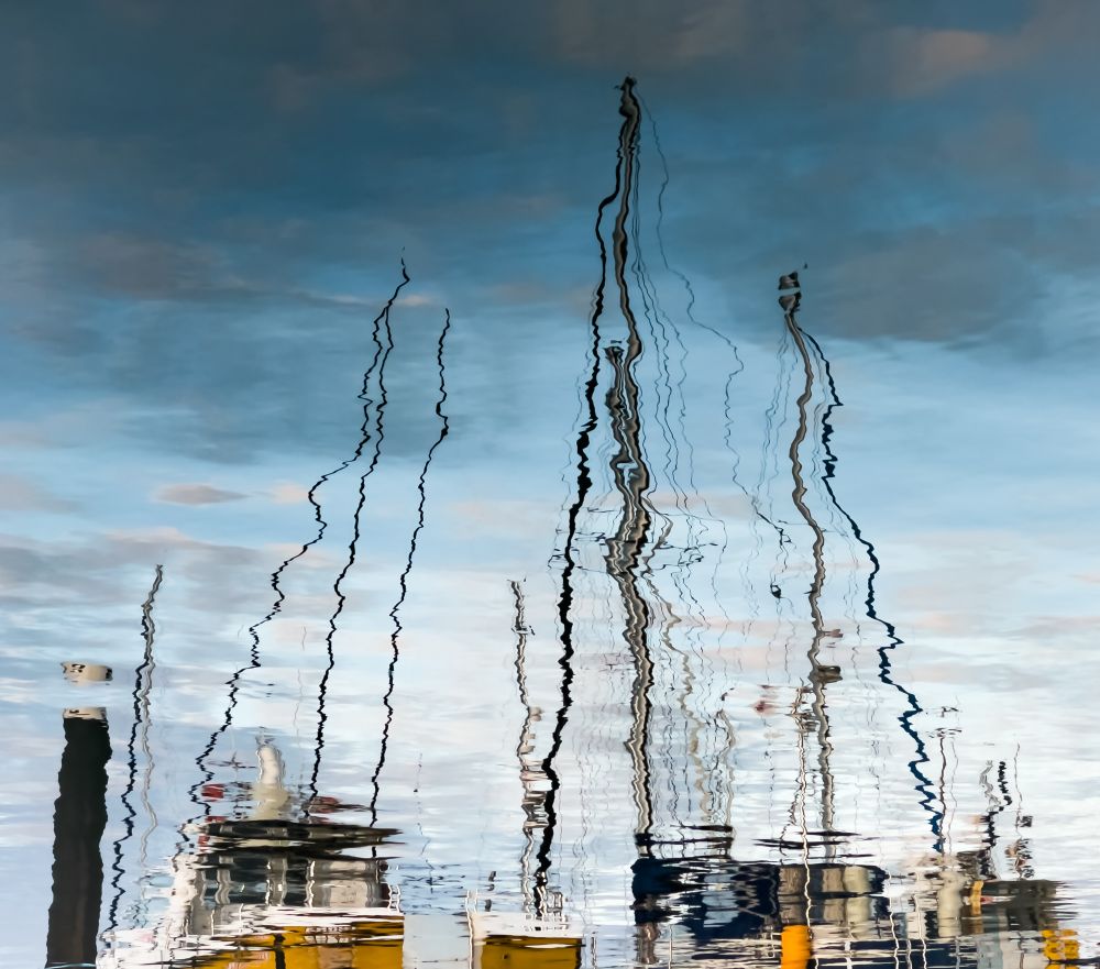 Reflections of masts of yachts in a marina based on North Coast, the sea water is so much clearer than the river where we usually berth. The gentle swell has moved the reflections sideways very slightly back and forth