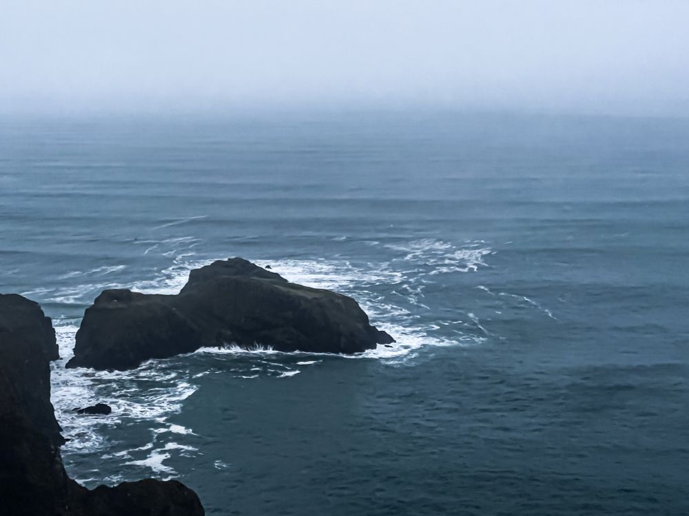 Looking out to sea at Portaneevy viewing point. Waves coming in sets maybe from Greenland. Too much swell for easy sailing, but good for surfing.