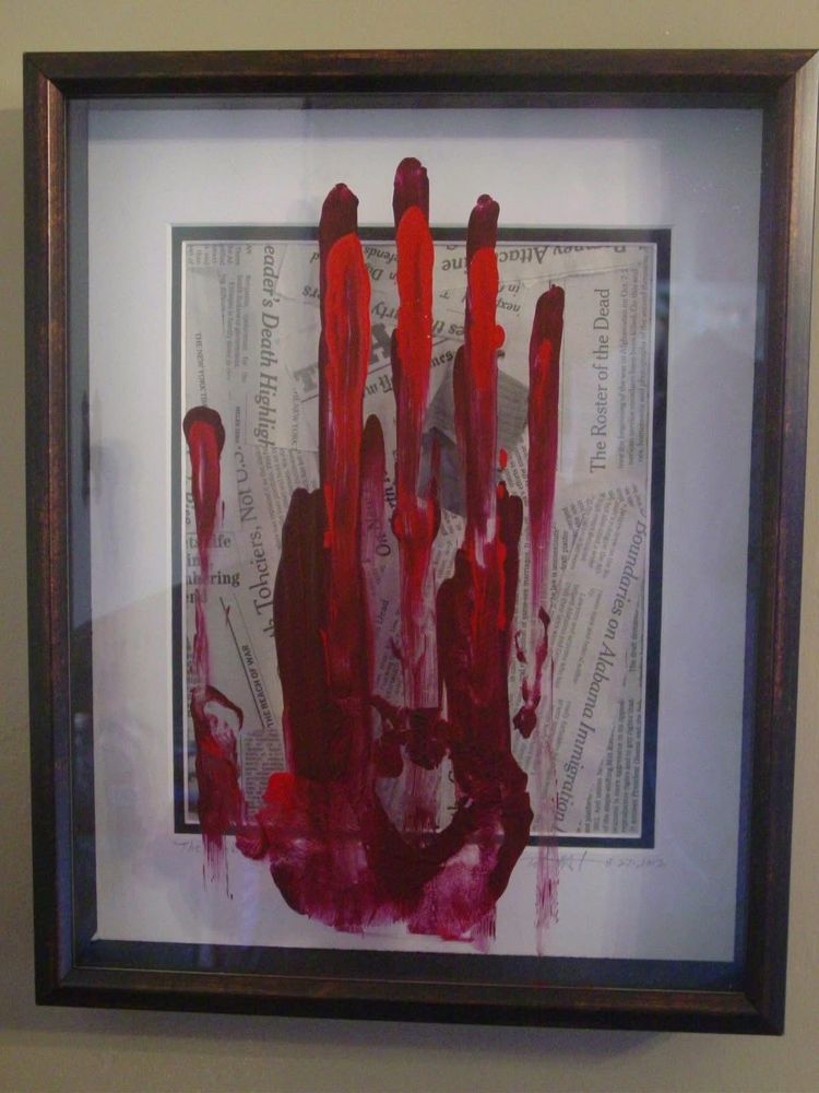 I did this thinking about the bloodshed that when a republican is in our Whitehouse always starts an endless war of death. Still ring true today. 
A bloody hand print running down a glass with newspaper clippings of death. 