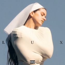 The cover of LUX by Rosalia, an album released on 7th November 2025.

"depicts Rosalía against a blue background in a white outfit resembling a nun's religious habit and veil. Her eyes are closed, her lips are coloured gold, and she is hugging herself with her arms underneath the outfit's torso."