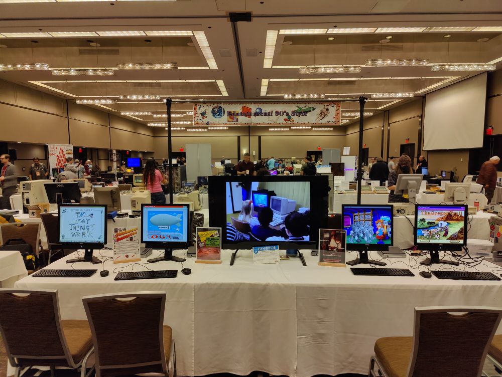 A row of computers and a television featuring edutainment content